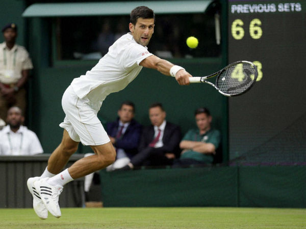 Novak Djokovic of Serbia plays a return to Adrian Mannarino of France during their men's singles match on day three of the Wimbledon Tennis Championships in London, on June 29, 2016 Novak Djokovic of Serbia plays a return to Adrian Mannarino of France during their men's singles match on day three of the Wimbledon Tennis Championships in London, on June 29, 2016