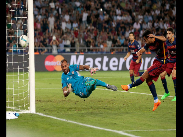 Pedro Rodriguez, 2nd right, shoots to score his side's 5th goal past Sevilla goalkeeper Beto during the UEFA Super Cup soccer match between FC Barcelona and Sevilla FC at the Boris Paichadze Dinamo Arena stadium. Pedro Rodriguez, 2nd right, shoots to score his side's 5th goal past Sevilla goalkeeper Beto during the UEFA Super Cup soccer match between FC Barcelona and Sevilla FC at the Boris Paichadze Dinamo Arena stadium.