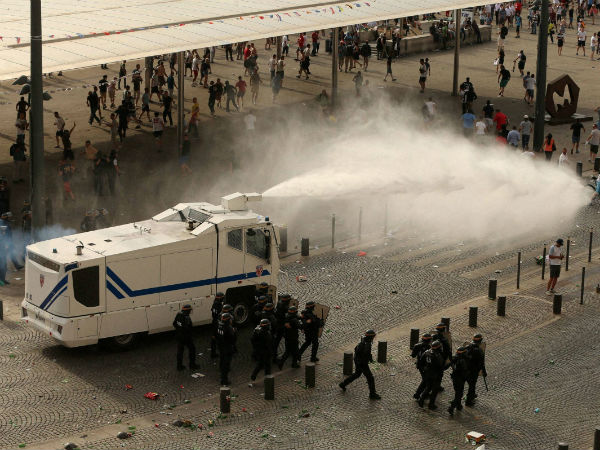 Police fire water cannons to control the fighting fter football fans clashed ahead of the England v Russia Euro 2016 soccer match, in Marseille, France, Saturday June 11, 2016. Police fire water cannons to control the fighting fter football fans clashed ahead of the England v Russia Euro 2016 soccer match, in Marseille, France, Saturday June 11, 2016.