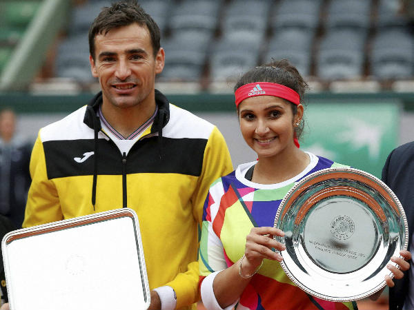 Sania (right) and Dodig with their trophies after the final Sania (right) and Dodig with their trophies after the final
