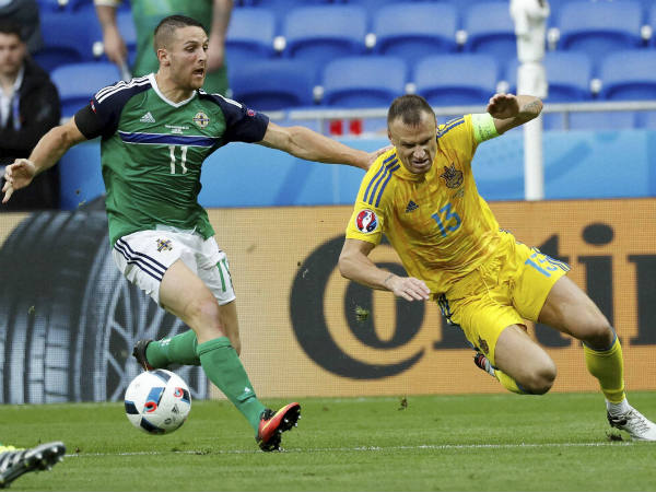 Ukraine's Vyacheslav Shevchuk, right, is challenged by Northern Ireland's Conor Washington during their Euro Group C match Ukraine's Vyacheslav Shevchuk, right, is challenged by Northern Ireland's Conor Washington during their Euro Group C match