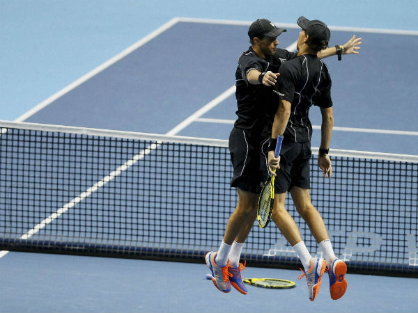United States’s Bob Bryan, right, leaps to chest bump his brother and playing partner United Sates’s Mike Bryan United States’s Bob Bryan, right, leaps to chest bump his brother and playing partner United Sates’s Mike Bryan