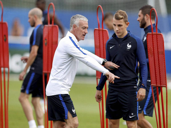France coach Didier Deschamps (left) talks to player Lucas Digne, right, during a training session France coach Didier Deschamps (left) talks to player Lucas Digne, right, during a training session