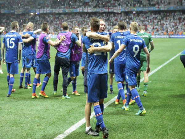Iceland's players celebrate at the end of the Euro 2016 round of 16 match between England and Iceland Iceland's players celebrate at the end of the Euro 2016 round of 16 match between England and Iceland
