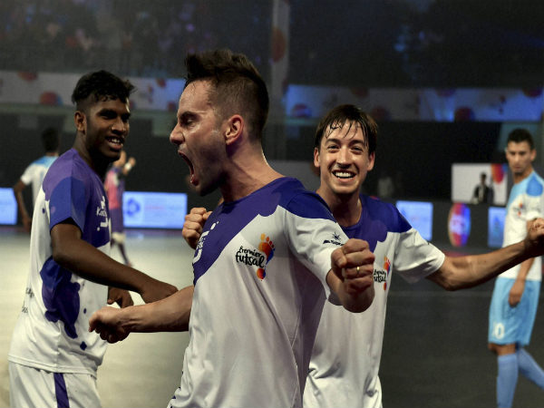 Kochi 5s futsal player Deives Moraes (Purple) celebrating with teammates after goal against Mumbai 5s(Blue) Kochi 5s futsal player Deives Moraes (Purple) celebrating with teammates after goal against Mumbai 5s(Blue)
