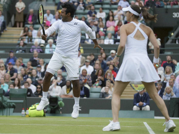 Leander Paes (left) and Martina Hingis during Wimbledon 2016 Leander Paes (left) and Martina Hingis during Wimbledon 2016
