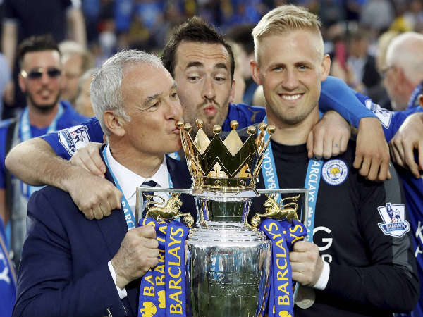 Leicester City manager Claudio Ranieri (left) celebrates with Christian Fuchs and Kasper Schmeichel Leicester City manager Claudio Ranieri (left) celebrates with Christian Fuchs and Kasper Schmeichel