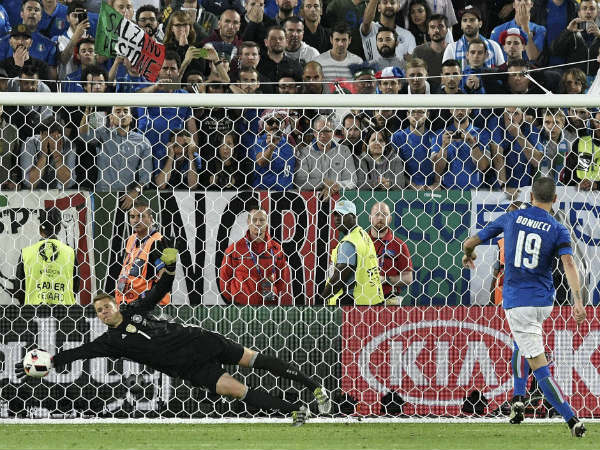 Germany goalkeeper Manuel Neuer stops a penalty from Italy's Leonardo Bonucci during a shoot out at the end of the Euro 2016 quarterfinal soccer match between Germany and Italy, at the Nouveau Stade in Bordeaux, France, Saturday, July 2, 2016. Germany defeated Italy 6-5 in a penalty shootout after the game ended tied 1-1. Germany goalkeeper Manuel Neuer stops a penalty from Italy's Leonardo Bonucci during a shoot out at the end of the Euro 2016 quarterfinal soccer match between Germany and Italy, at the Nouveau Stade in Bordeaux, France, Saturday, July 2, 2016. Germany defeated Italy 6-5 in a penalty shootout after the game ended tied 1-1.