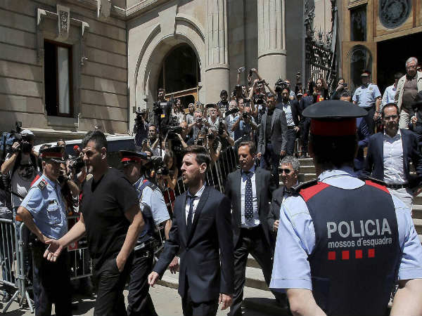 Lionel Messi (center) leaves a court in Barcelona Lionel Messi (center) leaves a court in Barcelona
