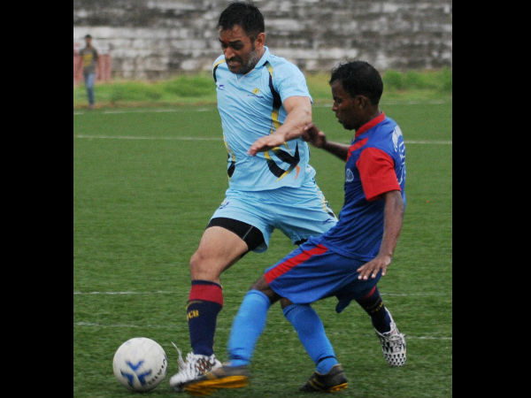 Indian Skipper Mahendra Singh Dhoni plays exhibition football match with local players at Silli 60 KMs away from Ranchi, Jharkhand. Indian Skipper Mahendra Singh Dhoni plays exhibition football match with local players at Silli 60 KMs away from Ranchi, Jharkhand.