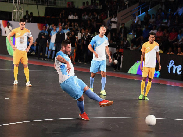 Mumbai 5's futsal player Adriano Foglia hits a goal against Chennai 5's (yellow) during their match at Premier Futsal Mumbai 5's futsal player Adriano Foglia hits a goal against Chennai 5's (yellow) during their match at Premier Futsal