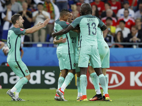 Portugal's Nani, centre, celebrates after scoring his side's second goal during the Euro 2016 semifinal soccer match between Portugal and Wales, at the Grand Stade in Decines-Charpieu, near Lyon, France, on July 6, 2016. Portugal's Nani, centre, celebrates after scoring his side's second goal during the Euro 2016 semifinal soccer match between Portugal and Wales, at the Grand Stade in Decines-Charpieu, near Lyon, France, on July 6, 2016.