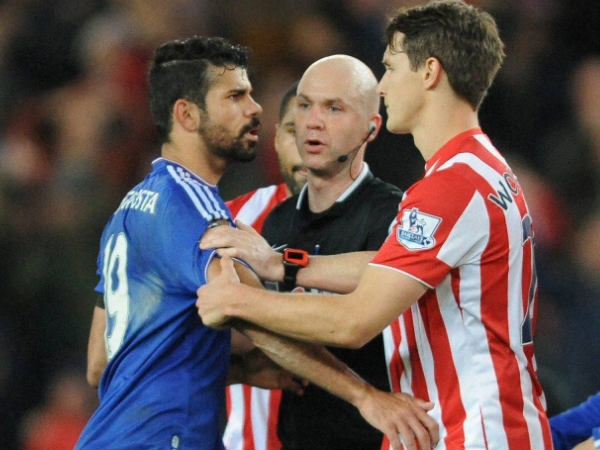Referee Anthony Taylor (middle) speaks to Chelsea’s Diego Costa (left) and Stoke’s Philipp Wollscheid during the English Premier League match Referee Anthony Taylor (middle) speaks to Chelsea’s Diego Costa (left) and Stoke’s Philipp Wollscheid during the English Premier League match