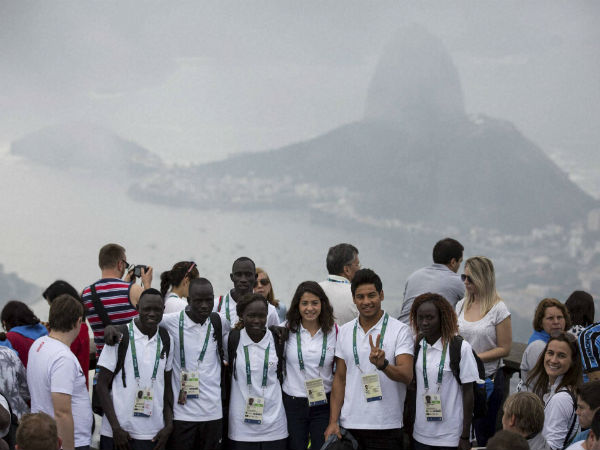 Members of the Refugee Olympic Team pose for a photo with the Sugar Loaf mountain in the background in Rio de Janeiro, Brazil, Saturday Members of the Refugee Olympic Team pose for a photo with the Sugar Loaf mountain in the background in Rio de Janeiro, Brazil, Saturday