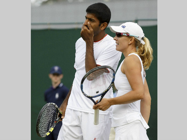 Rohan Bopanna talks to playing partner Anastasia Rodionova of Australia during their mixed doubles match against Juan-Sebastian Cabal and Maraiana Duque-Marino of Colombia Rohan Bopanna talks to playing partner Anastasia Rodionova of Australia during their mixed doubles match against Juan-Sebastian Cabal and Maraiana Duque-Marino of Colombia
