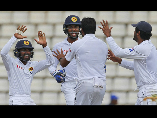 Sri Lankan team members celebrate the dismissal of Australia's Usman Khawaja with their bowler Dilruwan Perera, second right, on day four of the first test cricket match between Sri Lanka and Australia in Pallekele. Sri Lankan team members celebrate the dismissal of Australia's Usman Khawaja with their bowler Dilruwan Perera, second right, on day four of the first test cricket match between Sri Lanka and Australia in Pallekele.