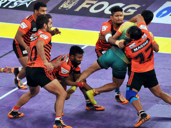 Patna Pirates (Green) and U Mumba (Orange) players in action during Pro-Kabaddi Season 4 match,at Netaji Indoor Stadium in Kolkata. Patna Pirates (Green) and U Mumba (Orange) players in action during Pro-Kabaddi Season 4 match,at Netaji Indoor Stadium in Kolkata.