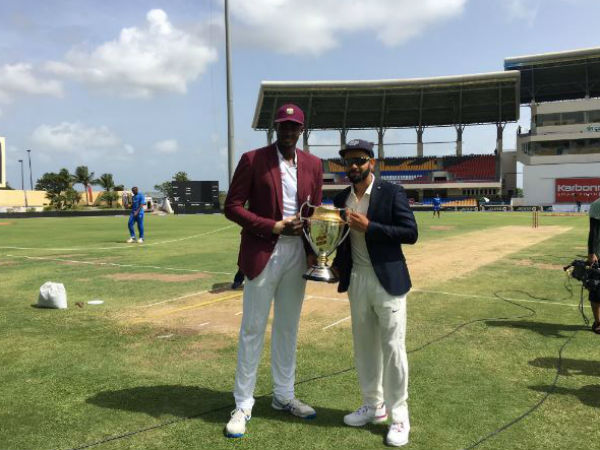 Captains Holder (left) and Kohli pose with the series trophy before the match. Photo from BCCI's Twitter page Captains Holder (left) and Kohli pose with the series trophy before the match. Photo from BCCI's Twitter page
