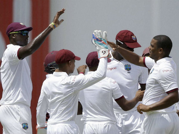 West Indies' bowler Shannon Gabriel, right, celebrates with teammates after dismissing India's Murali Vijay during day one of their first cricket Test match at the Sir Vivian Richards Stadium in North Sound, Antigua West Indies' bowler Shannon Gabriel, right, celebrates with teammates after dismissing India's Murali Vijay during day one of their first cricket Test match at the Sir Vivian Richards Stadium in North Sound, Antigua