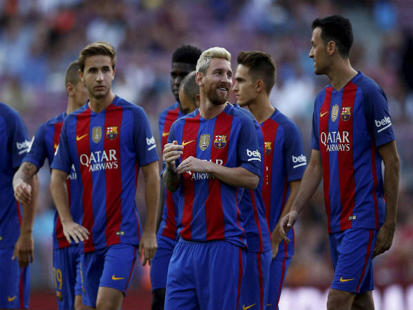 Lionel Messi (centre) alongside his FC Barcelona team mates Lionel Messi (centre) alongside his FC Barcelona team mates