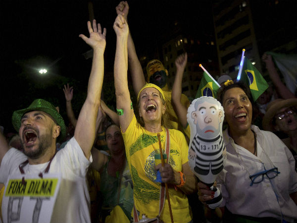 Anti-government demonstrators celebrate after the lower house of Congress voted to impeach Brazil's President Dilma Rousseff Anti-government demonstrators celebrate after the lower house of Congress voted to impeach Brazil's President Dilma Rousseff
