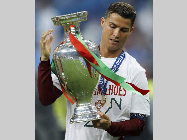 Cristiano Ronaldo holds the Euro 2016 trophy after winning the final against France in July Cristiano Ronaldo holds the Euro 2016 trophy after winning the final against France in July