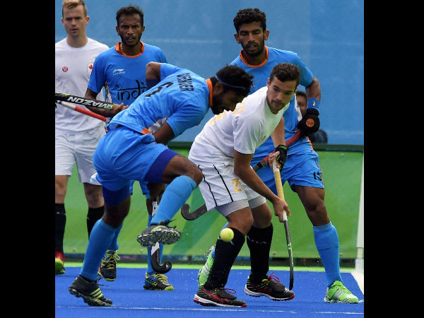 India's (blue) and Canada players in action during their Men's hockey match at Summer Olympics 2016 in Rio de Janeiro, Brazil on Friday. India's (blue) and Canada players in action during their Men's hockey match at Summer Olympics 2016 in Rio de Janeiro, Brazil on Friday.