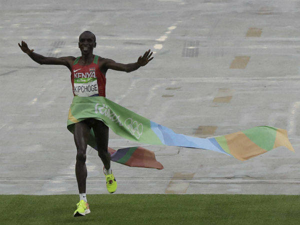 Kenya's Eliud Kipchoge celebrates as she crosses the finish line to win the gold medal the men's marathon at the 2016 Summer Olympics in Rio de Janeiro, Brazil. Kenya's Eliud Kipchoge celebrates as she crosses the finish line to win the gold medal the men's marathon at the 2016 Summer Olympics in Rio de Janeiro, Brazil.