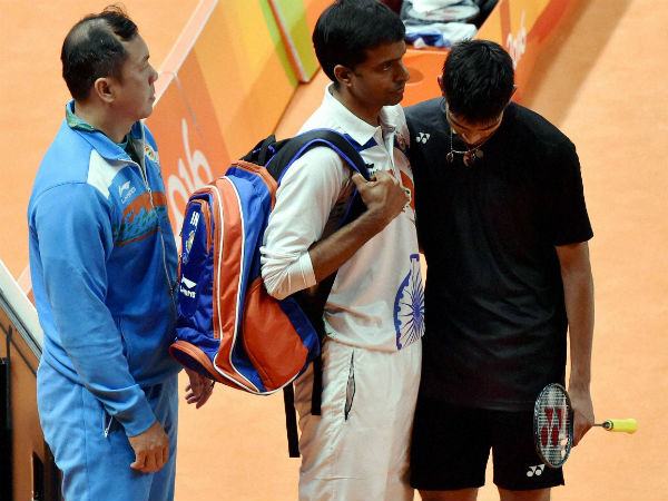India's Srikanth Kidambi with coach P Gopichand after losing to Lin Dan of China the quarterfinal match of Men's Singles Badminton at 2016 Summer Olympics at Rio de Janerio in Brazil on Wednesday. India's Srikanth Kidambi with coach P Gopichand after losing to Lin Dan of China the quarterfinal match of Men's Singles Badminton at 2016 Summer Olympics at Rio de Janerio in Brazil on Wednesday.
