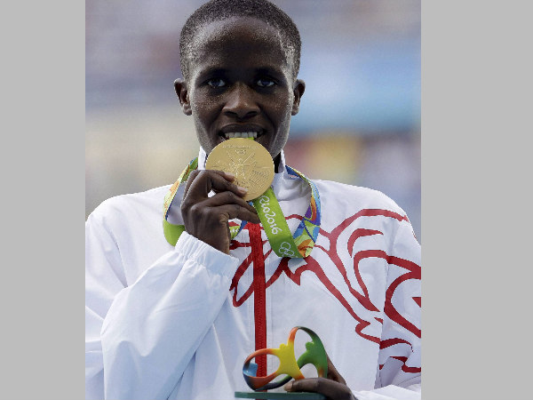 Bahrain's Ruth Jebet shows off her gold medal during the ceremony for the women's 3000-meter steeplechase final Bahrain's Ruth Jebet shows off her gold medal during the ceremony for the women's 3000-meter steeplechase final