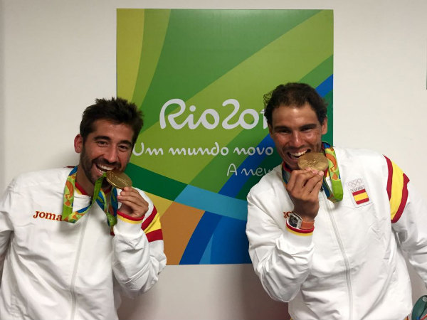 Rafael Nadal (right) with his doubles partner Marc Lopez biting their gold medal at Rio Olympics (Image courtesy: Rafa Nadal Twitter handle) Rafael Nadal (right) with his doubles partner Marc Lopez biting their gold medal at Rio Olympics (Image courtesy: Rafa Nadal Twitter handle)