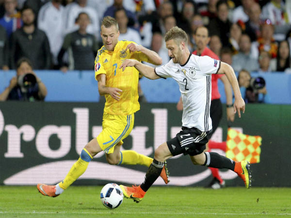 Shkodran Mustafi (right) fights for the ball with Ukraine's Andriy Yarmolenko during the Euro 2016 Group C match Shkodran Mustafi (right) fights for the ball with Ukraine's Andriy Yarmolenko during the Euro 2016 Group C match
