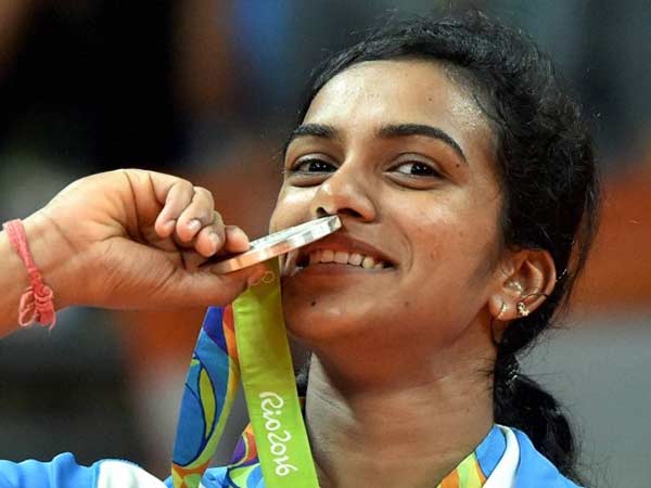 PV Sindhu kisses her silver medal at Rio Olympics PV Sindhu kisses her silver medal at Rio Olympics