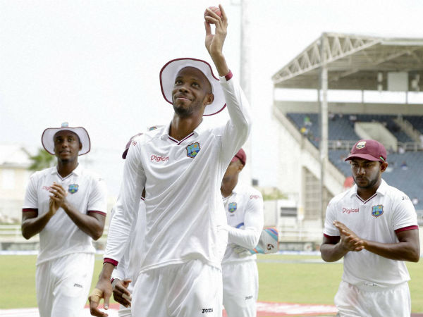 Roston Chase holds the ball up after taking 5 wickets against India in the 2nd Test Roston Chase holds the ball up after taking 5 wickets against India in the 2nd Test