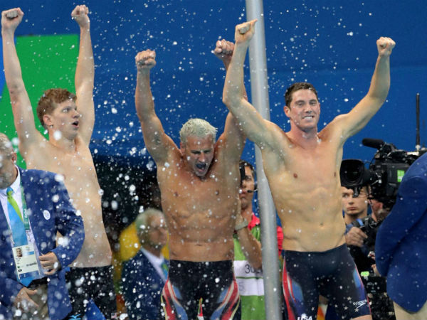 United States' Townley Haas, left, Ryan Lochte, center, and Conor Dwyer celebrate as Michael Phelps, in the pool, finishes to win the gold medal in the men's 4x200-meter freestyle final during the swimming competitions at the 2016 Summer Olympics. United States' Townley Haas, left, Ryan Lochte, center, and Conor Dwyer celebrate as Michael Phelps, in the pool, finishes to win the gold medal in the men's 4x200-meter freestyle final during the swimming competitions at the 2016 Summer Olympics.