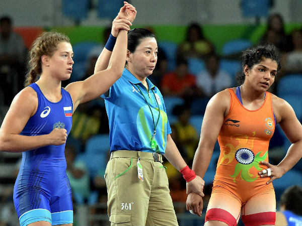 Russian wrestler Valeria Koblova celebrates after winning against India's Sakshi Malik during the quarterfinal match of Women's freestyle 58 kg at Summer Olympics 2016 at Rio de Janeiro in Brazil on Wednesday. Russian wrestler Valeria Koblova celebrates after winning against India's Sakshi Malik during the quarterfinal match of Women's freestyle 58 kg at Summer Olympics 2016 at Rio de Janeiro in Brazil on Wednesday.