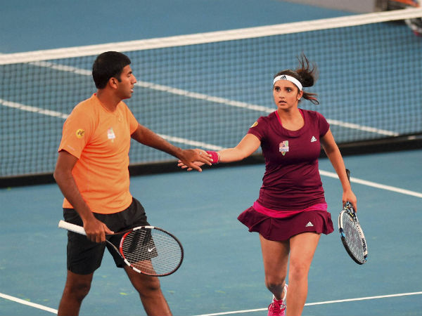 Sania Mirza and Rohan Bopanna during their mix doubles match against Manila Mavericks players Flipkens and Nester at the International Premier Tennis League Sania Mirza and Rohan Bopanna during their mix doubles match against Manila Mavericks players Flipkens and Nester at the International Premier Tennis League