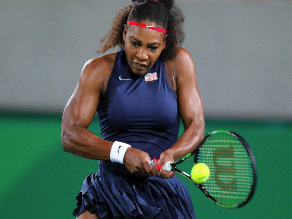 Serena Williams of the United States returns to France's Alize Cornet in the women's tennis competition at the Rio Olympics 2016 Serena Williams of the United States returns to France's Alize Cornet in the women's tennis competition at the Rio Olympics 2016