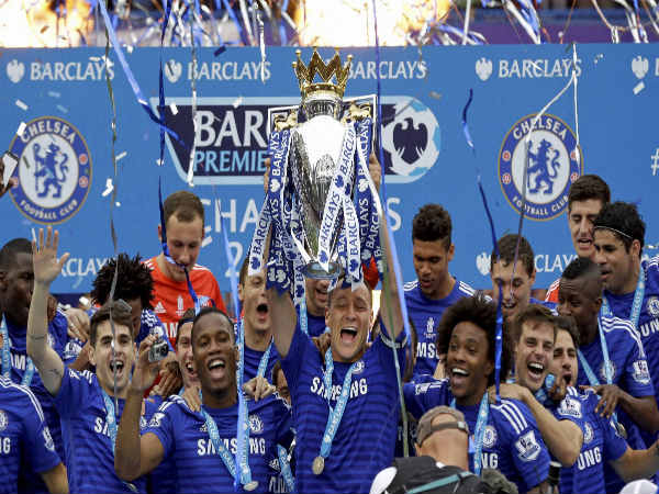 John Terry holds Premier League trophy along with Chelsea team mates John Terry holds Premier League trophy along with Chelsea team mates
