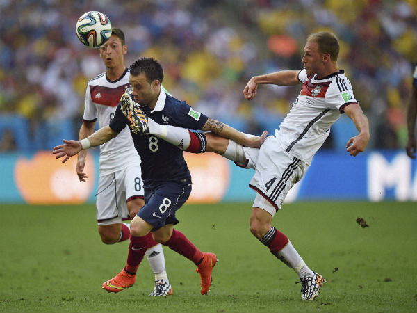 Mathieu Valbuena (center) goes past German midfielders Mathieu Valbuena (center) goes past German midfielders