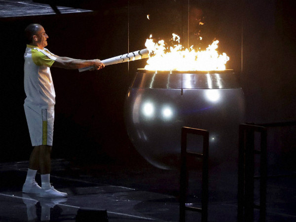 Vanderlei de Lima lights the Olympic flame during the opening ceremony Vanderlei de Lima lights the Olympic flame during the opening ceremony