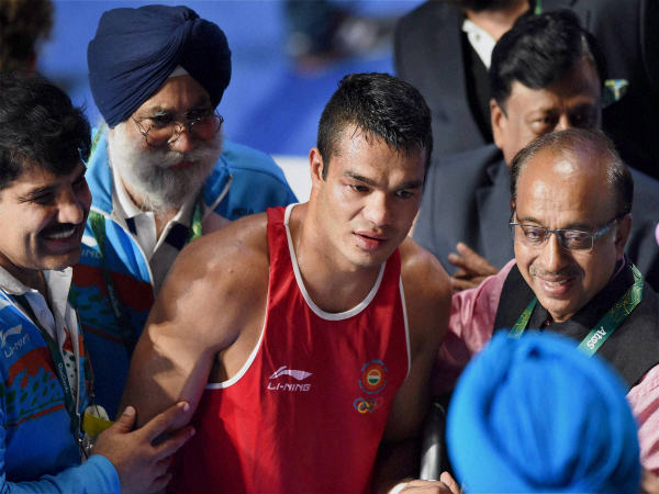 Vikas Krishnan Yadav (red) alongside Union Sports Minister Vijay Goel Vikas Krishnan Yadav (red) alongside Union Sports Minister Vijay Goel