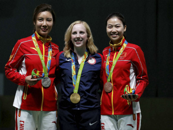 Gold medal winner, Virginia Thrasher, centre, poses for a picture with silver medal winner, Du li of China, left, and bronze medalist China's Yi Siling, during the victory ceremony for the Women's 10m Air Rifle event Gold medal winner, Virginia Thrasher, centre, poses for a picture with silver medal winner, Du li of China, left, and bronze medalist China's Yi Siling, during the victory ceremony for the Women's 10m Air Rifle event