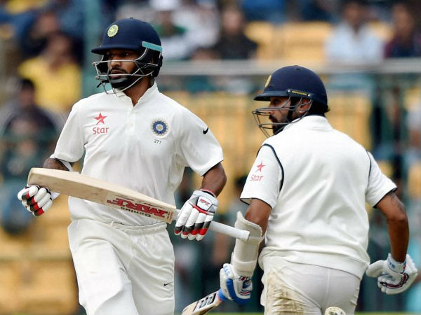India's Shikhar Dhawan And Murali Vijay Run Between The Wickets During The 1st Day Of 2nd Test Match Between India And South Africa At Chinnaswamy Stadium In Bengaluru. India's Shikhar Dhawan And Murali Vijay Run Between The Wickets During The 1st Day Of 2nd Test Match Between India And South Africa At Chinnaswamy Stadium In Bengaluru.