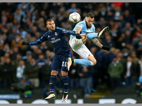 Real Madrid's Rodriguez Jese and Manchester City's Nicolas Otamendi, right, battle for the ball during the Champions League semifinal soccer match at the Etihad Stadium, Manchester. Real Madrid's Rodriguez Jese and Manchester City's Nicolas Otamendi, right, battle for the ball during the Champions League semifinal soccer match at the Etihad Stadium, Manchester.