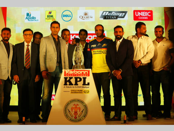 The players and officials pose in front of KPL trophy The players and officials pose in front of KPL trophy