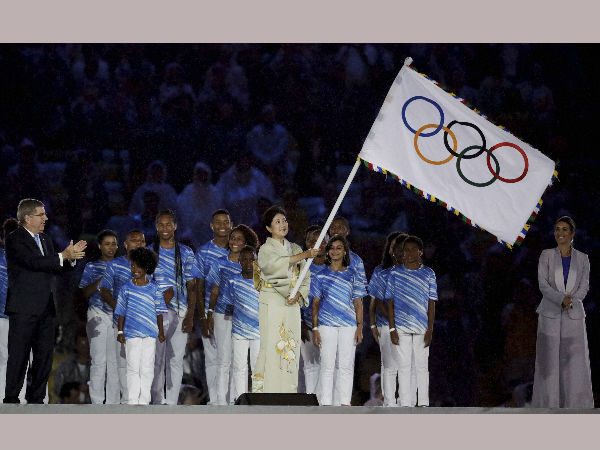 Tokyo Governor Yuriko Koike waves the Olympic flag as IOC President Thomas Bach stands at left during the closing ceremony in the Maracana stadium at the 2016 Summer Olympics in Rio de Janeiro, Brazil, on Aug. 21, 2016. Tokyo Governor Yuriko Koike waves the Olympic flag as IOC President Thomas Bach stands at left during the closing ceremony in the Maracana stadium at the 2016 Summer Olympics in Rio de Janeiro, Brazil, on Aug. 21, 2016.