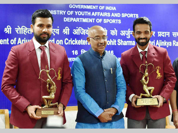 Sports Minister Vijay Goel (centre) conferred Arjuna Awards on cricketers Rohit Sharma (left) and Ajinkya Rahane for the year 2015 and 2016 respectively. Sports Minister Vijay Goel (centre) conferred Arjuna Awards on cricketers Rohit Sharma (left) and Ajinkya Rahane for the year 2015 and 2016 respectively.