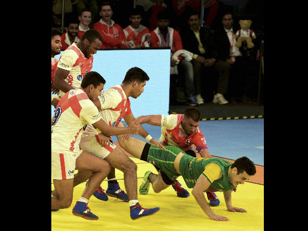 England players try to catch Australian player during their "Kabaddi World Cup 2016" match in Ahmedabad on Monday. England players try to catch Australian player during their "Kabaddi World Cup 2016" match in Ahmedabad on Monday.