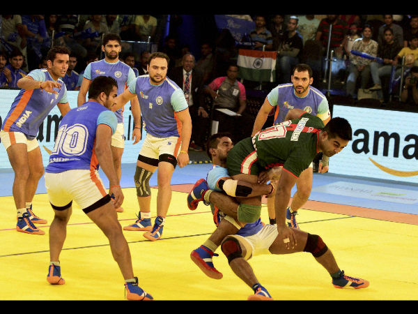 Indian players try to catch player from Bangladesh during their Kabaddi World Cup 2016 match in Ahmedabad on Tuesday. Indian players try to catch player from Bangladesh during their Kabaddi World Cup 2016 match in Ahmedabad on Tuesday.